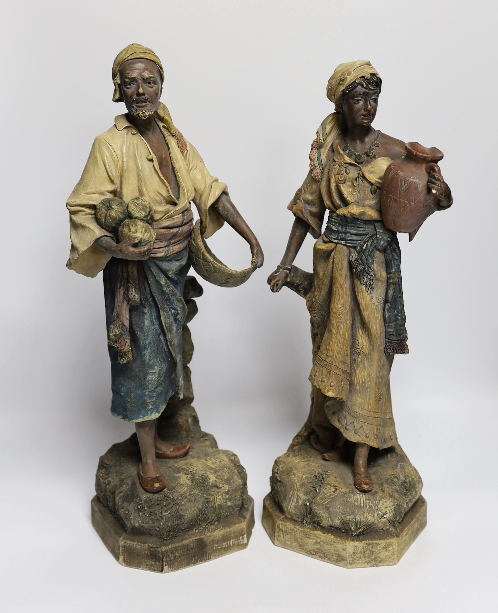 A pair of Goldscheider type Nubian figures, tallest 46cm